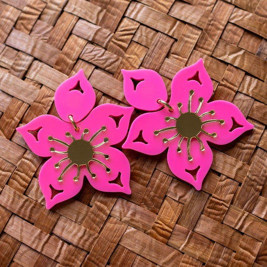 hot pink salmonberry florals on a cedar mat