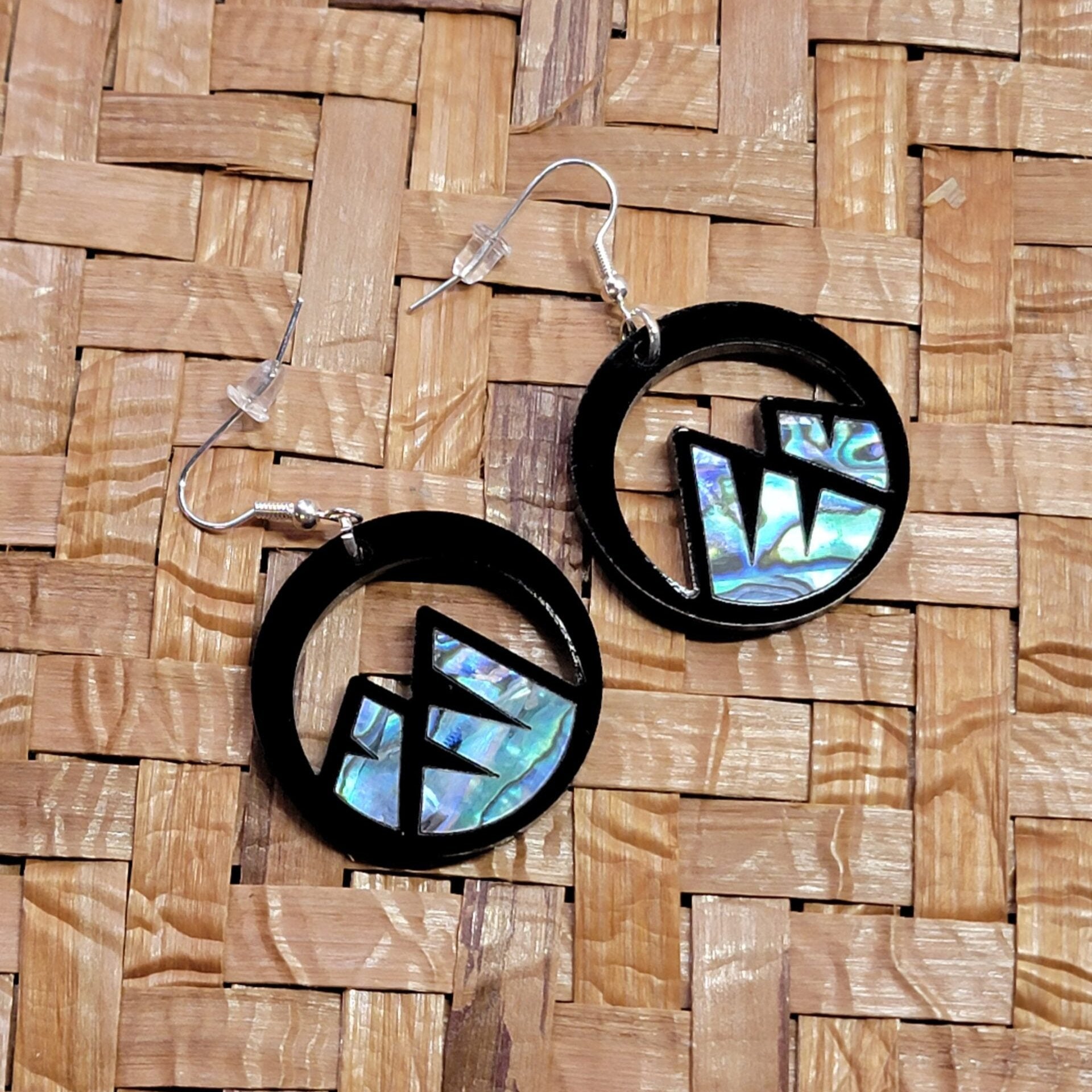 black acrylic earring with mountain cut out and abalone inlay from copper canoe woman