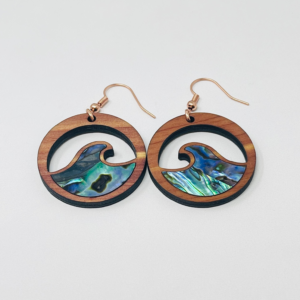 cedar earring with wave cut out and abalone inlay from copper canoe woman