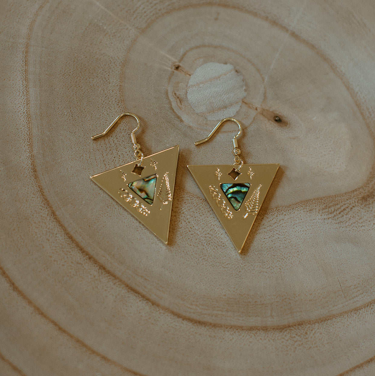 14k gold luxury indigenous triangle earring with hook.