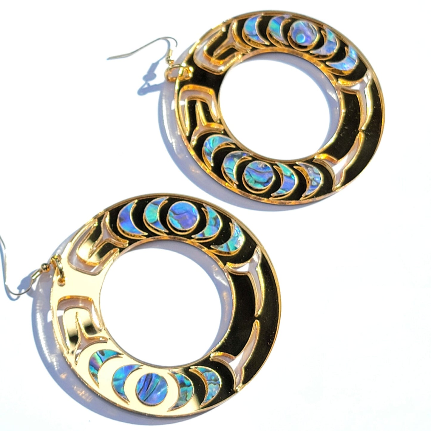 A pair of gold mirror Nala Hoops from Copper Canoe Woman.