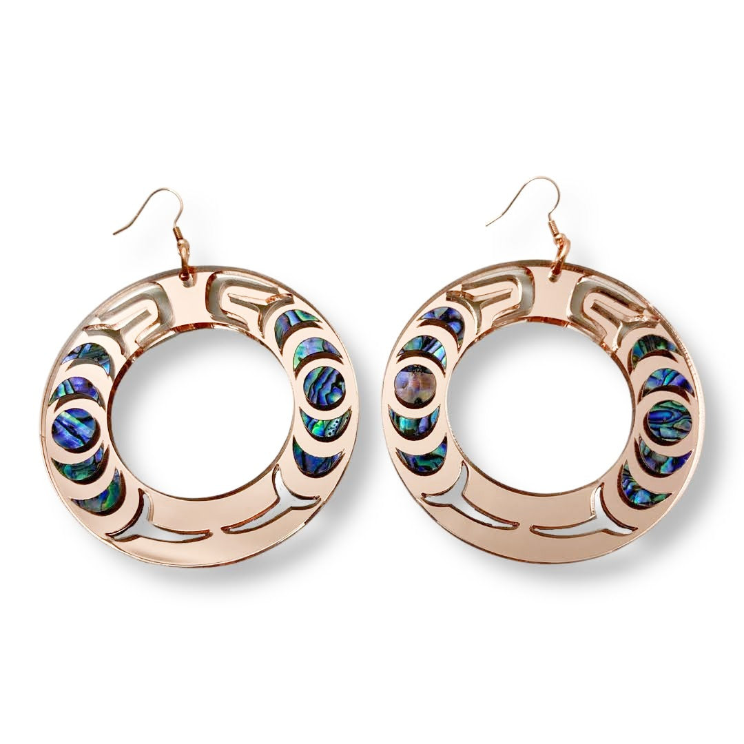 A pair of rose gold mirror acrylic Nala Hoop earrings from Copper Canoe Woman.