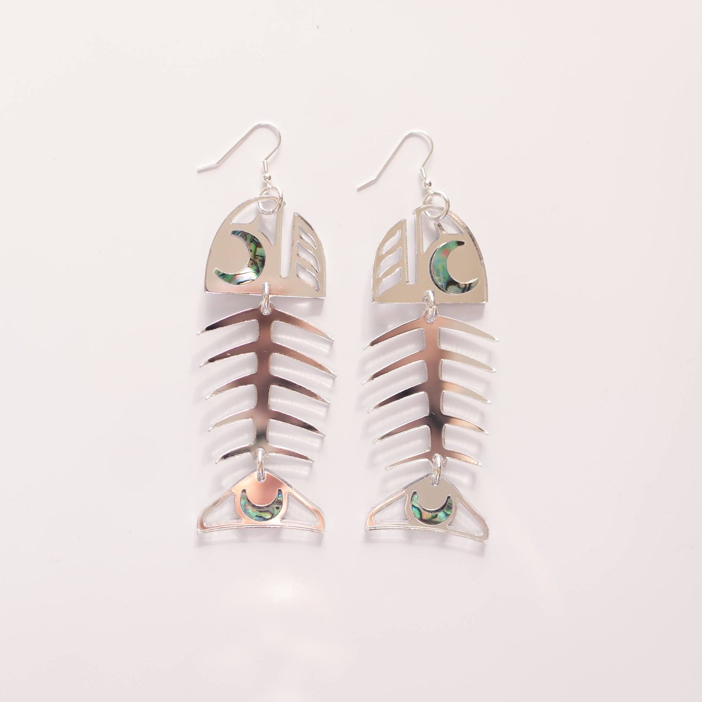 A pair of silver mirror Medium Salmon Ghost earrings from Copper Canoe Woman.