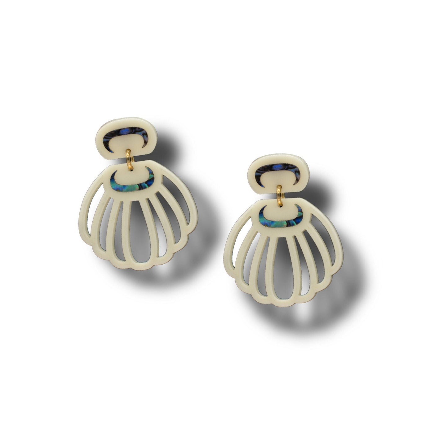 A pair of Shell Woman earrings from Copper Canoe Woman in ivory acrylic.