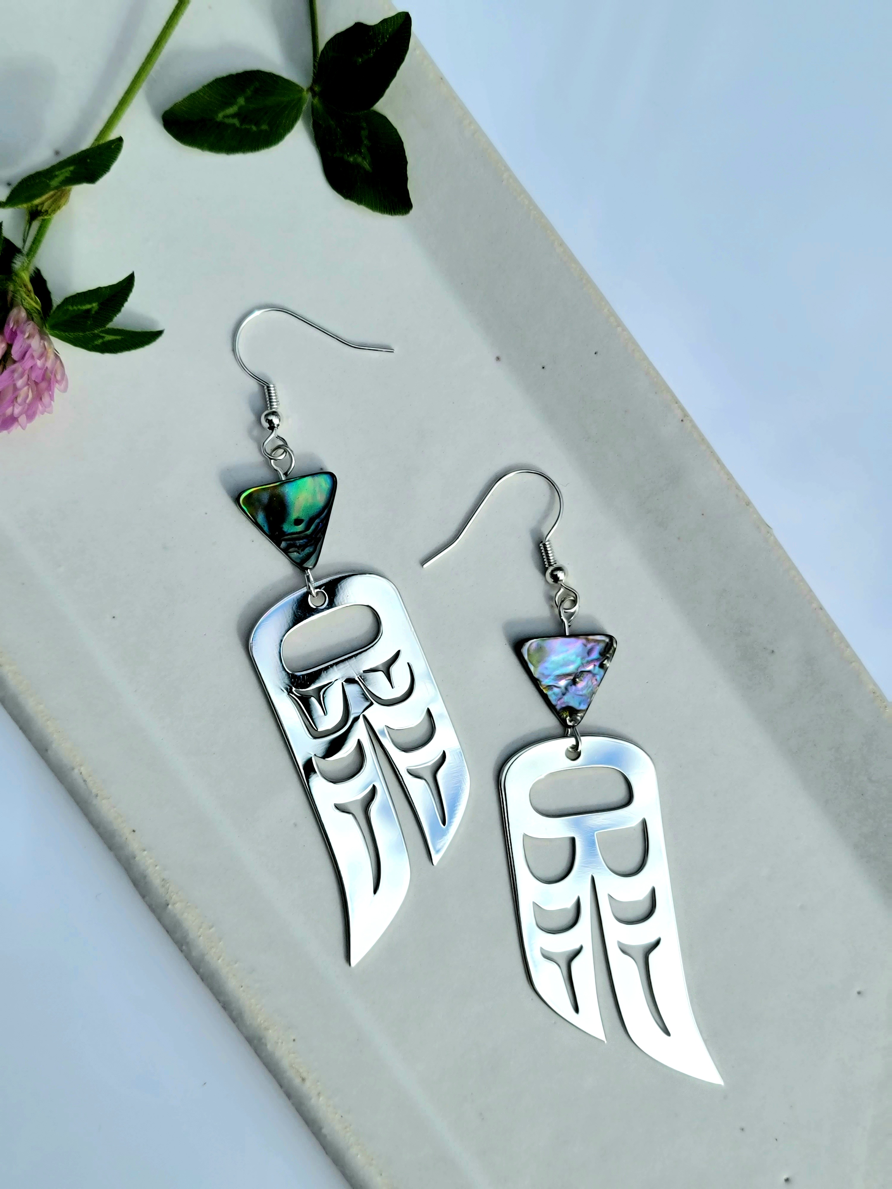 Eagle and raven wing shaped earrings with abalone gem.