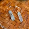 Hoop earring with light blue quartz stone.