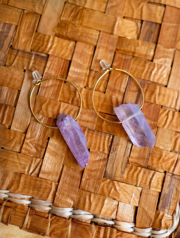 Hoop earring with purple quartz.