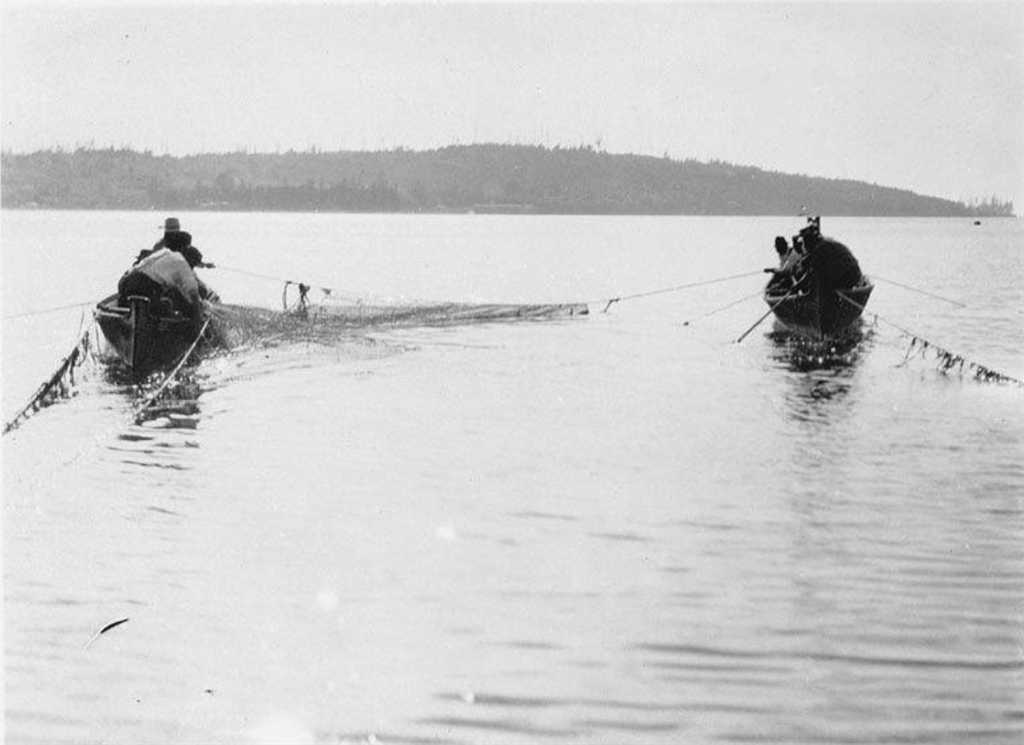 Lummi reefnetters setting net in 1930s